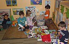 Checking out all the books they picked from the bookmobile