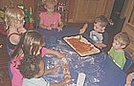 Spreading home made tomato sauce on the pizza dough