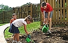 Watering our freshly planted peppers