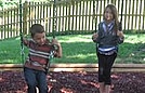 Kayleigh and Aiden swinging