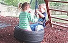 Having fun on the tire swing