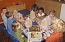 Painting milk jugs to create jack-o-lanterns