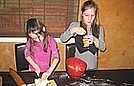 Brianna is adding butter to the sweet potatoes