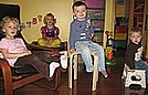 The bears sitting on their chairs (and Goldilocks waiting for her turn to go to the forest)