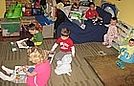Reading books to their stuffed animals
