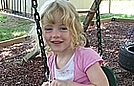 Savannah is pretending the swing is a horse