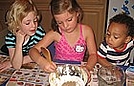 Mixing corn starch and sand to make sand dough