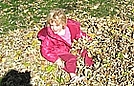 Savannah jumped in the leaf pile