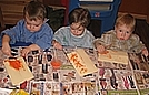 Using sand paint to paint a picture of a pumpkin