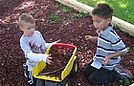 Logan and Michael filling up the dump truck