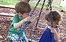 Charlotte and Nicholas had lots of fun on the tire swing