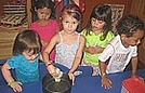 Charlotte is buttering the pan