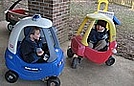 Logan and Michael riding big cars