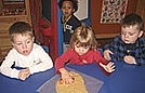 Cutting out gingerbread man shapes