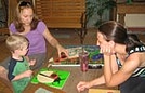 Ethan is loving the attention he is getting from Jana and Kathrin at the Nature Center