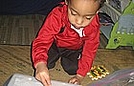 Corin is tracing his name on a light box