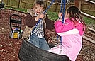 Having fun on the tire swing