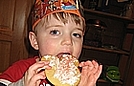 Our birthday boy is eating his Micky Mouse cookie