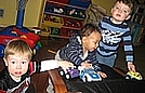 The boys are playing with their cars