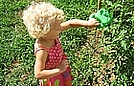 Lindsay is watering the tomatoes