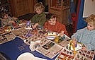 Finger painting paper plate hats