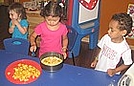 Putting fresh peaches on the dough